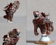 Kraken-13cm na výšku,přilepený na dubové destičce.